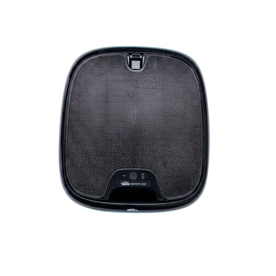 Top-down studio product view of the Maytronics Dolphin Skimmi 200 robotic pool skimmer on an isolated white background, showing its square-rounded shape, dark solar panel surface, top handle latch, and status control module with Skimmi 200 branding.