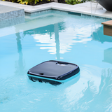 Maytronics Dolphin Skimmi cordless robotic surface skimmer actively floating and cleaning a modern backyard swimming pool.
