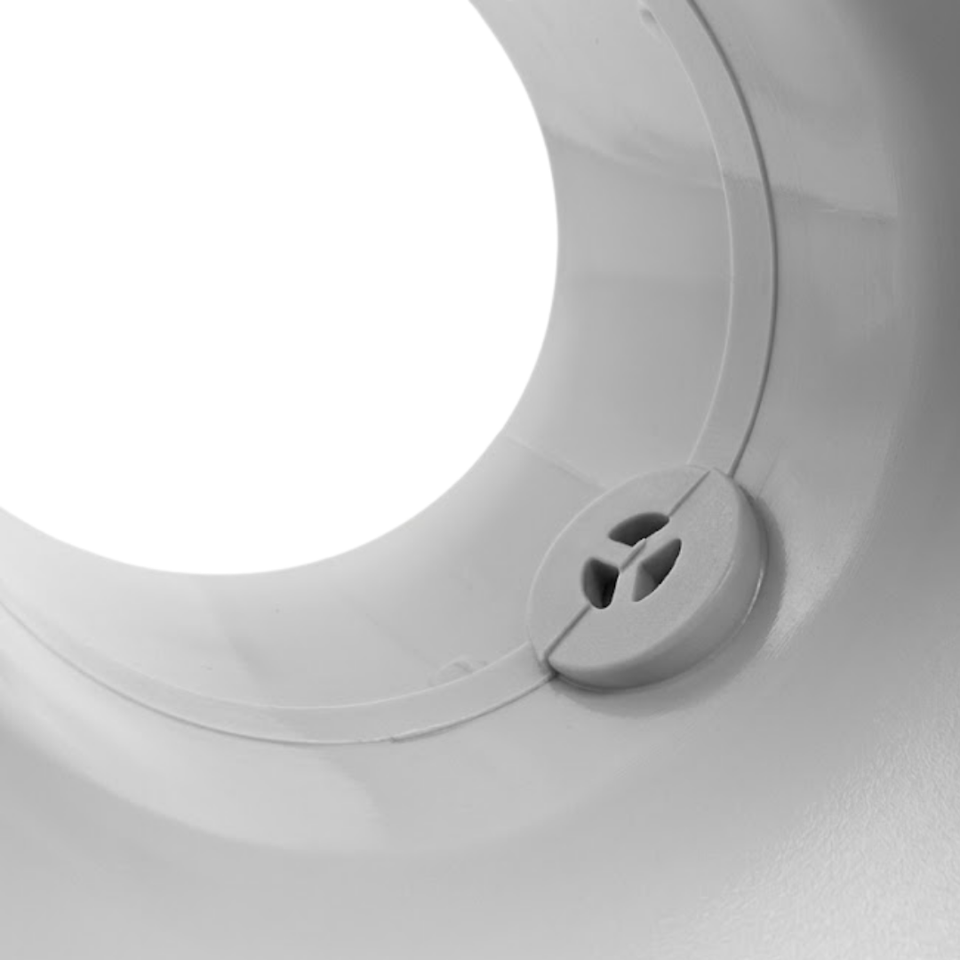 Extreme macro close-up view looking inside the socket of an Onga spa bath pump swivel tail union, showing the internal circular air bleed inlet plug.