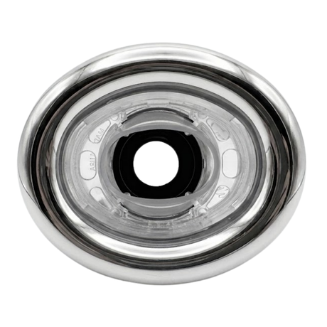 Direct overhead front view of an Ovo Swim WMetal 2in SX 12in Artesian spa jet insert, featuring an oval stainless steel trim bezel and clear plastic internal nozzle housing with a central black port.