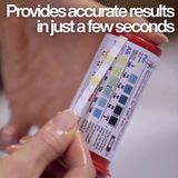 Close-up of a hand holding a Poppits Peroxsil test strip against the color chart on the bottle with text: "Provides accurate results in just a few seconds," showing Peroxide ppm and Alkalinity scales.