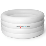 An empty, large white inflatable RecoveryTub Team ice bath tub isolated on a white background, showing its round, multi-ring tiered structure and the brand logo on the side