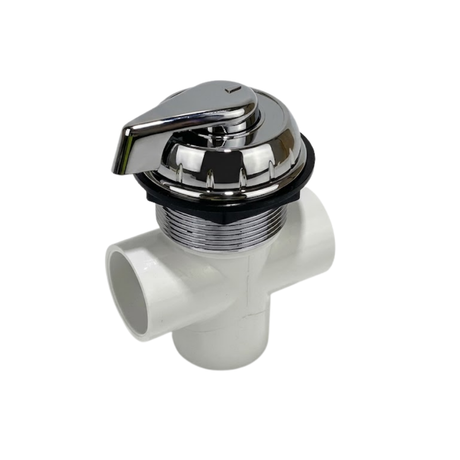 An angled top view of an assembled small spa diverter valve showing the polished chrome teardrop lever handle and textured cap on a white plastic 3 way plumbing manifold body