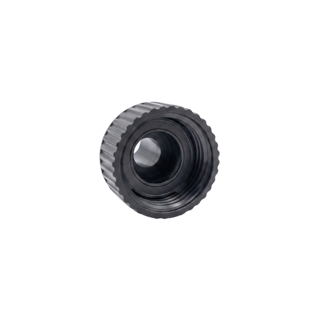 A front angled view looking directly inside the female opening of a black plastic spa drain tap connector showing the deep internal threads and clear center hole