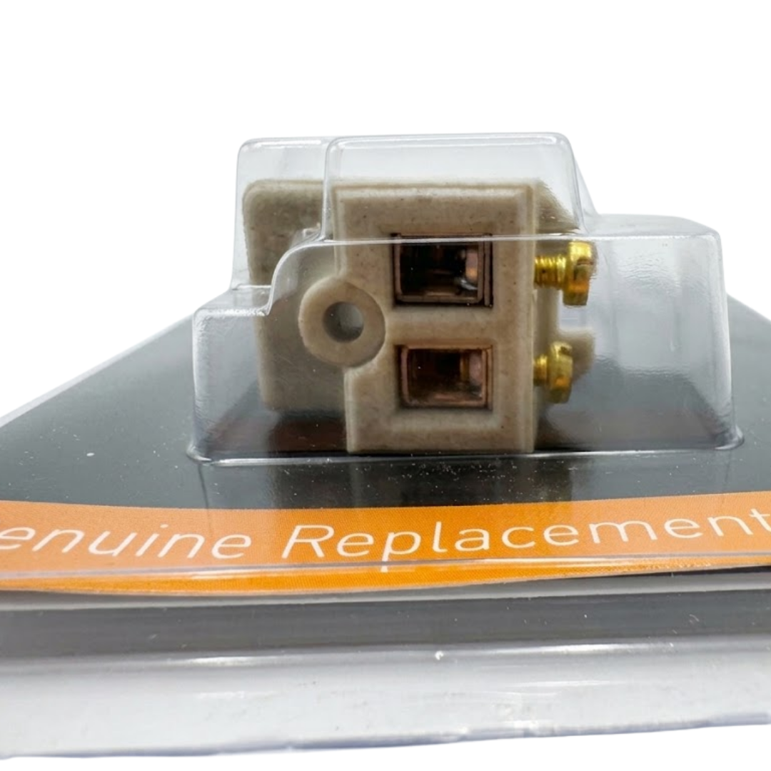 Close-up view through blister packaging of the ceramic socket base on a Spa Electrics 12V WN250 replacement globe, showing two copper contact ports and adjacent brass screws.
