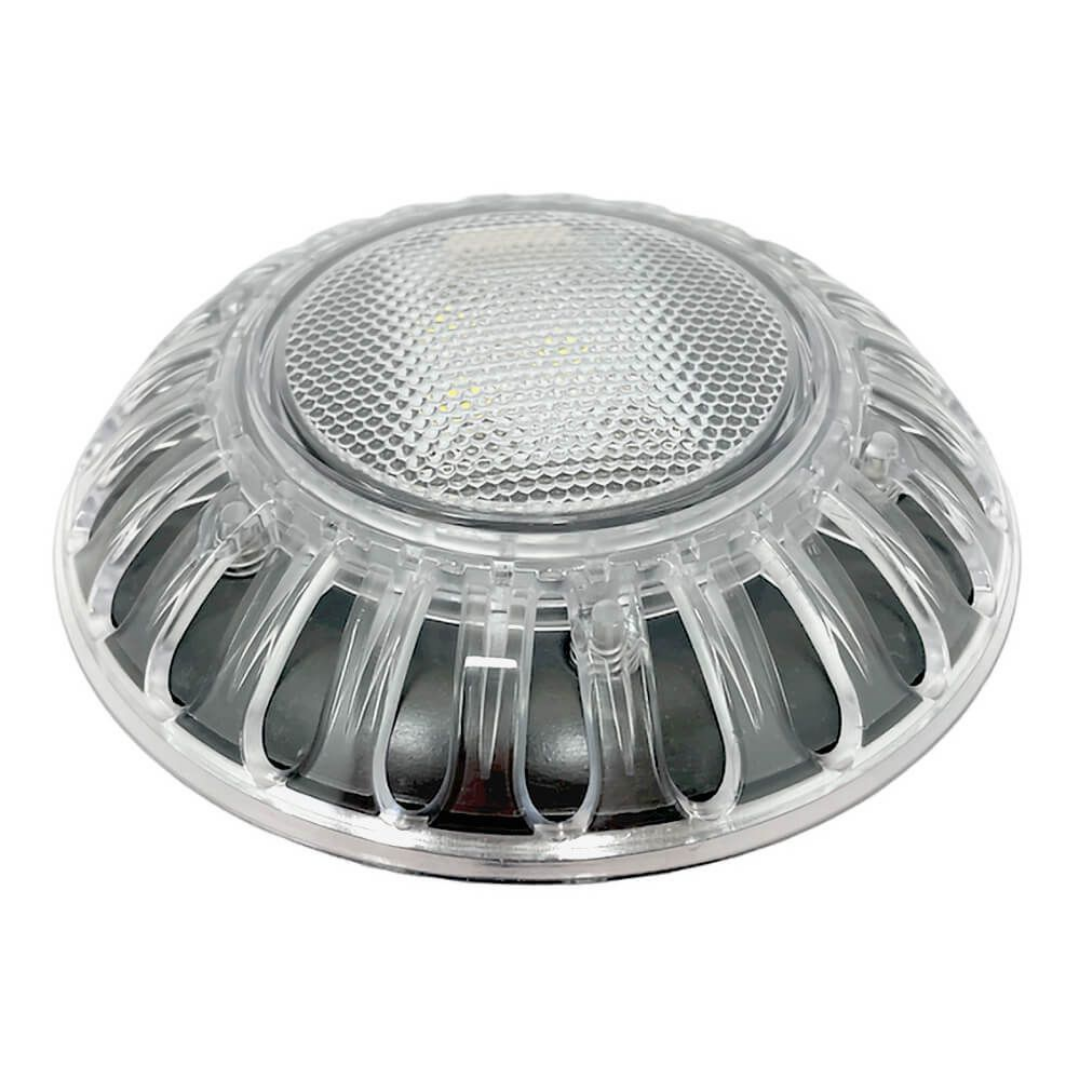 Low-angle perspective view of an unlit Spa Electrics EMF Multi Plus LED pool light head showcasing the clear dome lens, honeycomb textured face, and ribbed outer trim casing.