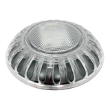 Low-angle perspective view of an unlit Spa Electrics EMF Multi Plus LED pool light head showcasing the clear dome lens, honeycomb textured face, and ribbed outer trim casing.