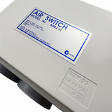 Close-up angled shot of the Space Age Electronics AS02-H 15A air switch label alongside an embossed Gewiss GW 44 206 IP56 enclosure stamp.