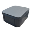 A gray hard cover for a spa or hot tub, designed to fit over the top with a skirt around the edge.