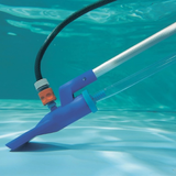 Close-up underwater view of the Swimsafe Supa-Vac setup as a venturi pump, showing a garden hose attached with an orange connector and a clear drainage hose siphoning water from a clean swimming pool floor.