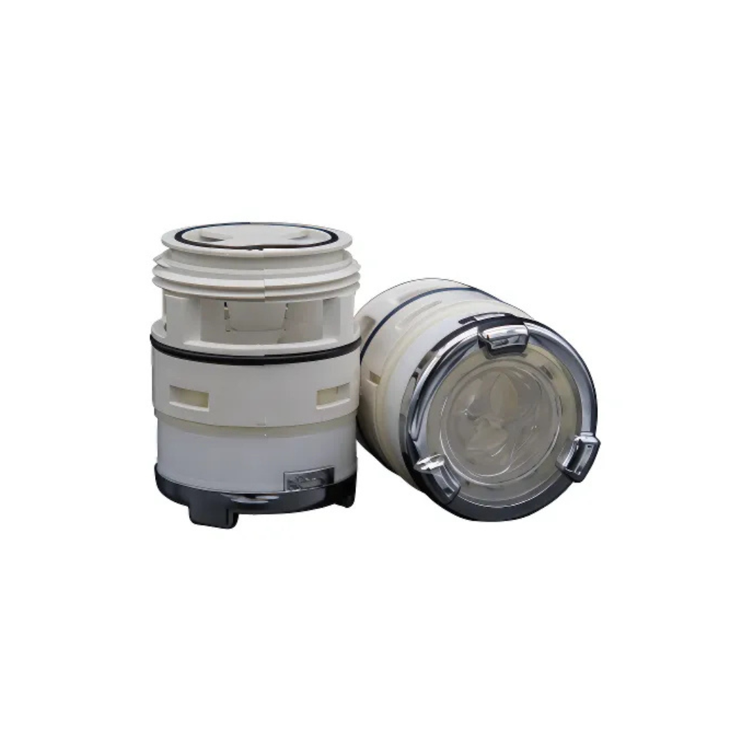 Studio view of two replacement swirl spa jet internal inserts side-by-side, one upright showcasing the off-white plastic body and threaded end, and one laying on its side revealing the front clear face and polished chrome bezel ring.