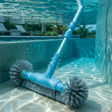 Underwater action view of a blue plastic corner brush scrubbing tiled swimming pool walls and floor joints using an extension telescopic pole.