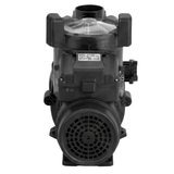 Direct rear studio view of a Zodiac FloPro SS 2.0 HP pool pump, showing the circular vented motor fan cowl, top terminal box with serial label plate, clear lid handles, and discharge port isolated on white.