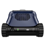 Rear view of a Zodiac FreeRideriQ cordless robotic pool cleaner showing the navy blue body with a wave-pattern exhaust grille and the lower black control panel featuring a green battery indicator, charging port, and start switch.